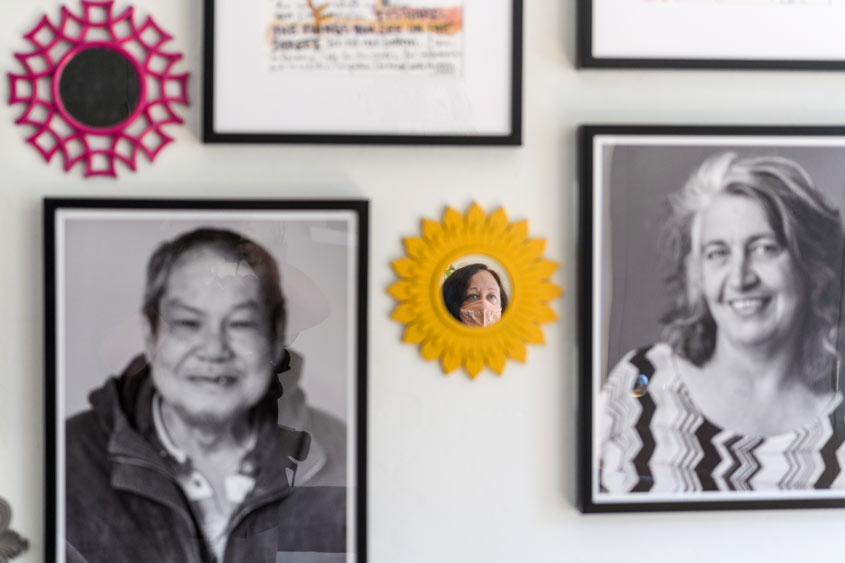 Kathy's reflection is seen on one of the mirrors on the wall.